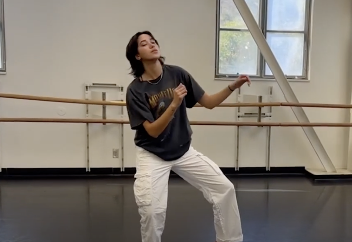 a woman bending front leg in mid dance routine